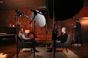 Patient testimonial video interview setup with two chairs facing a camera